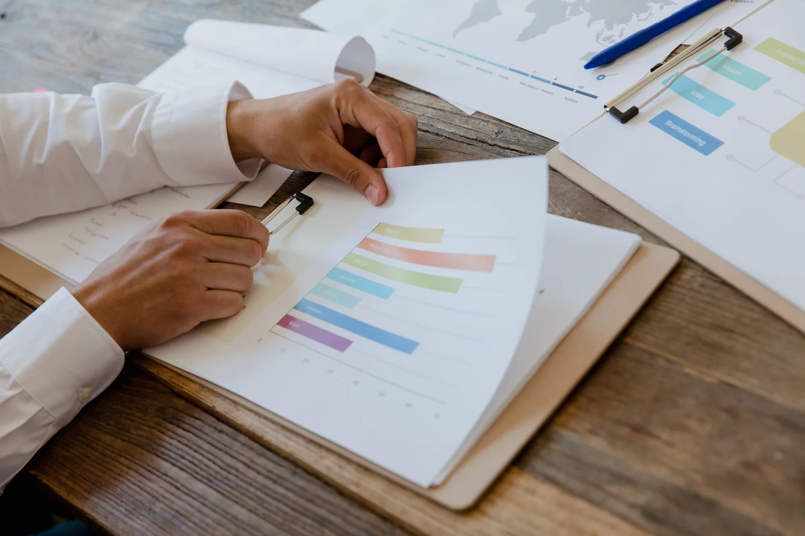 Reviewing business reports and findings at a desk