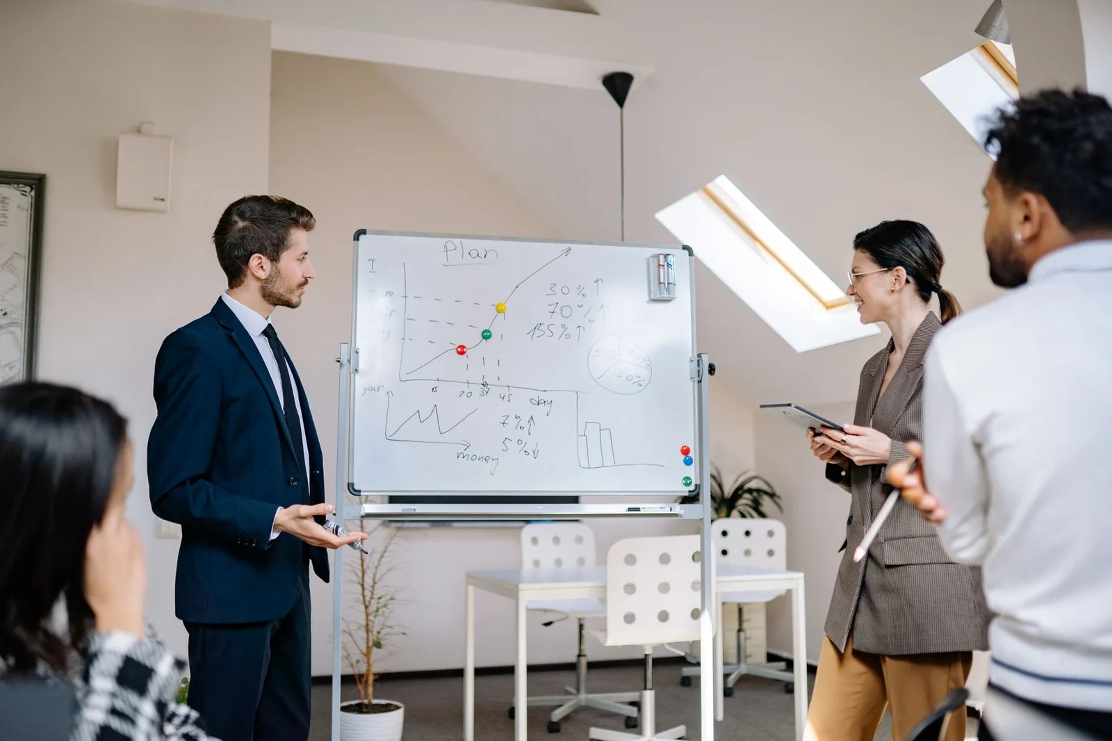 Colleagues reviewing business information together in a meeting